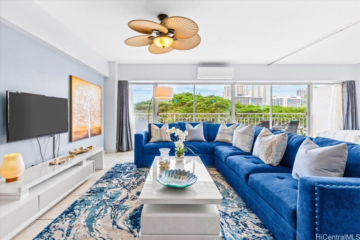 2161 Kalia Road, Unit 402 Honolulu, HI 96815 - Photo 11 of 25 a living room with furniture and a flat screen tv