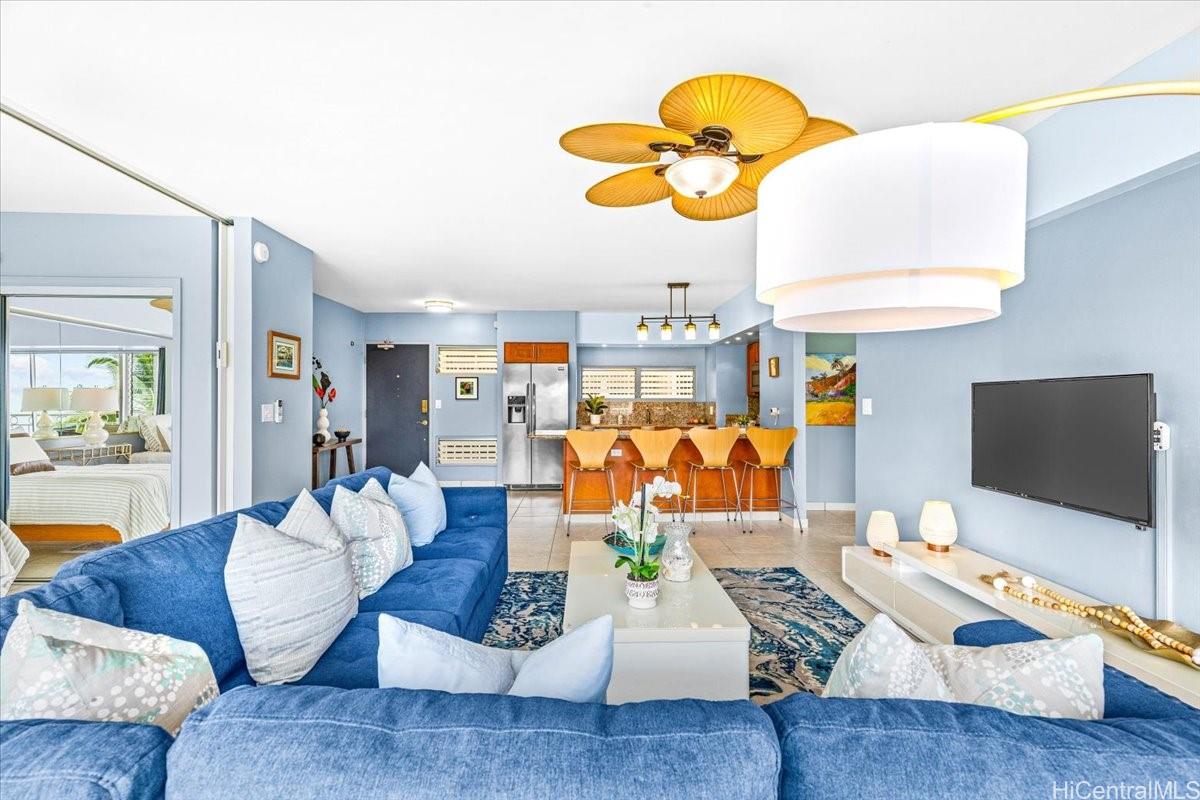 2161 Kalia Road, Unit 402 Honolulu, HI 96815 - Photo 13 of 25 a living room with furniture and a flat screen tv