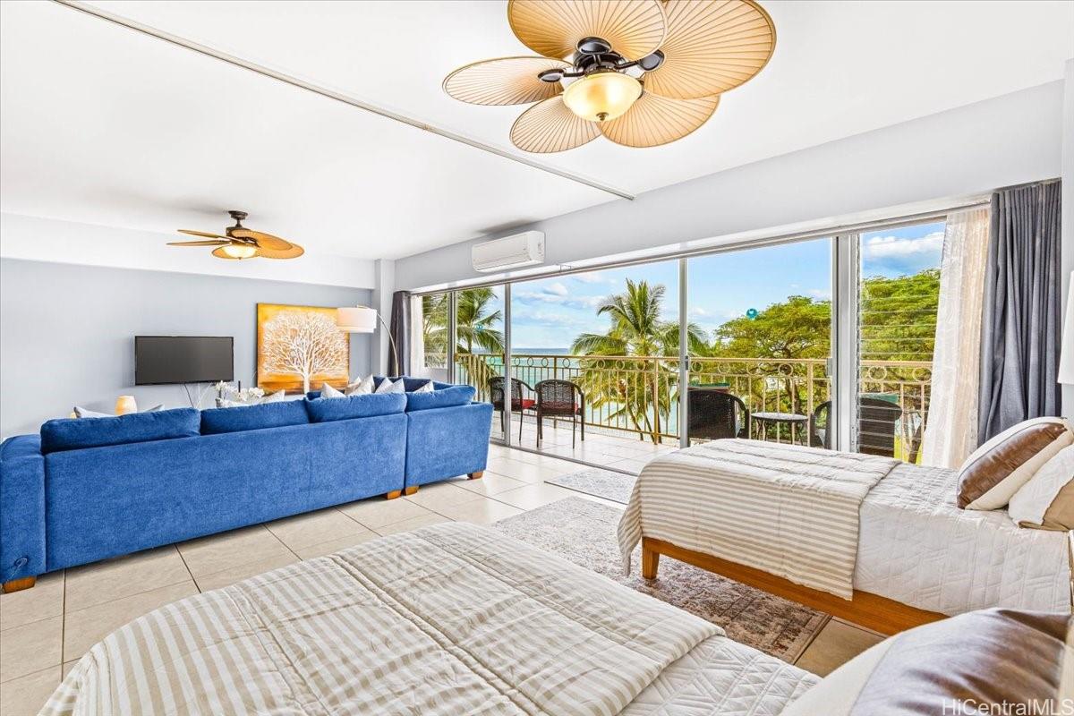 2161 Kalia Road, Unit 402 Honolulu, HI 96815 - Photo 14 of 25 a living room with furniture and a large window