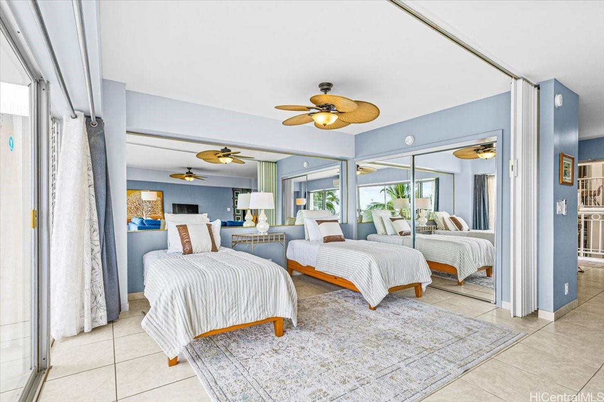 2161 Kalia Road, Unit 402 Honolulu, HI 96815 - Photo 16 of 25 a bedroom with a bed and ceiling fan