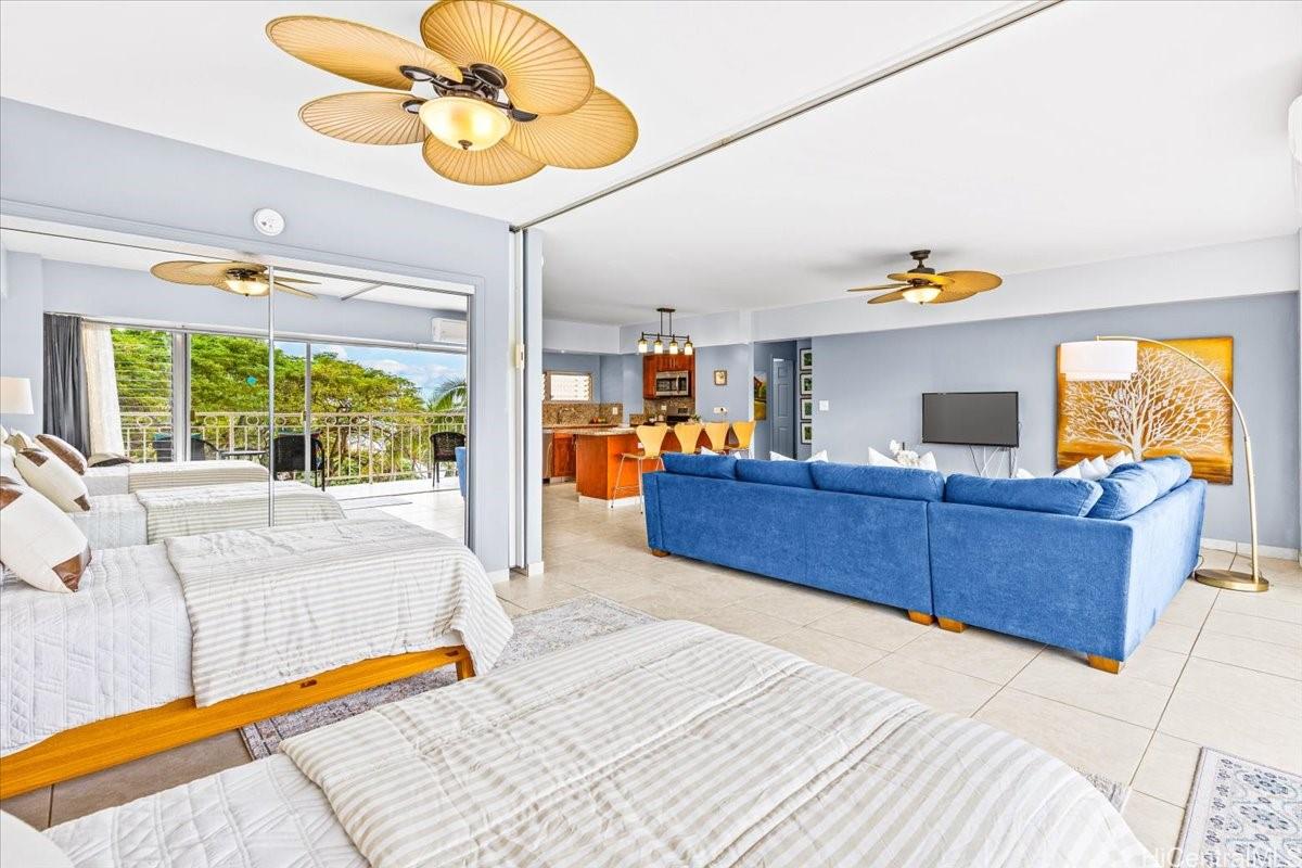 2161 Kalia Road, Unit 402 Honolulu, HI 96815 - Photo 18 of 25 a bed room with a bed and a chandelier