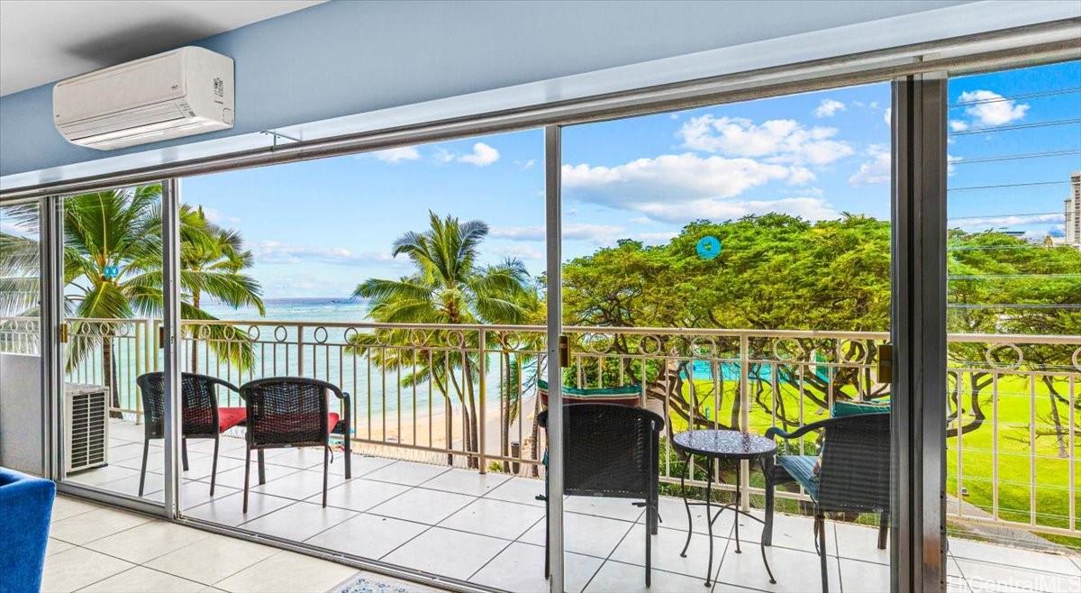 2161 Kalia Road, Unit 402 Honolulu, HI 96815 - Photo 4 of 25 a living room filled with furniture and a potted plant