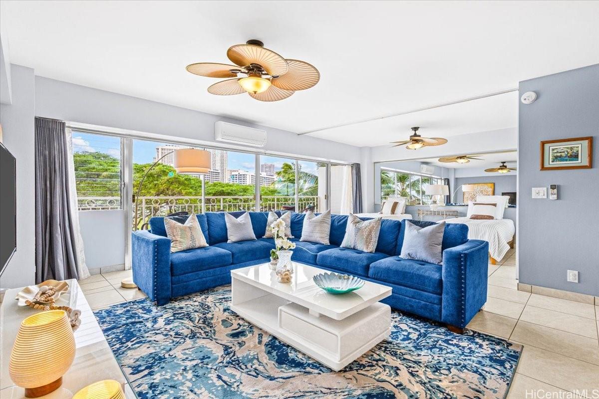 2161 Kalia Road, Unit 402 Honolulu, HI 96815 - Photo 10 of 25 a living room with furniture and a large window