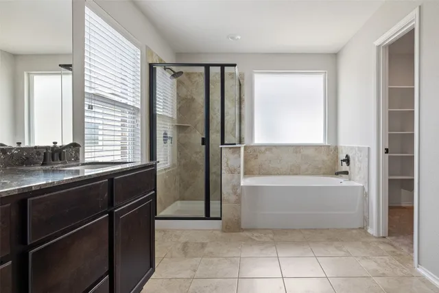 a bathroom with a bathtub and a sink