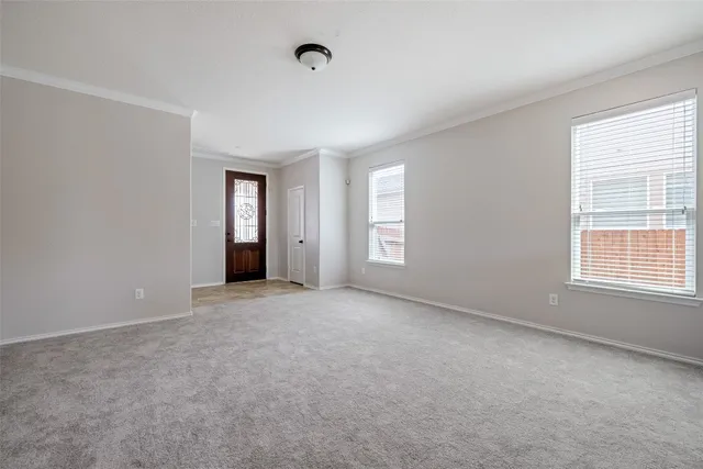 a view of an empty room with a window