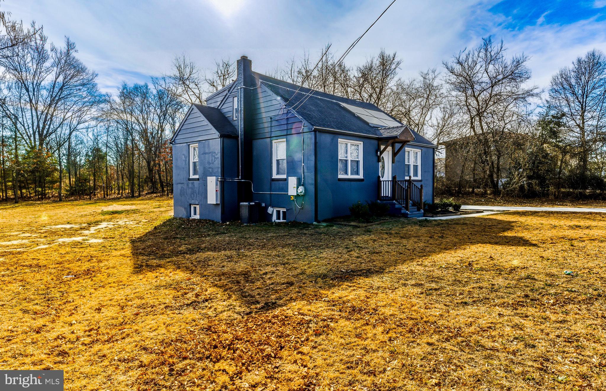 1287 Clements Bridge Road Woodbury, NJ 08096 - Photo 3 of 16 a view of a house with a yard