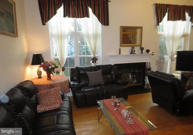 a living room with furniture fireplace and a flat screen tv