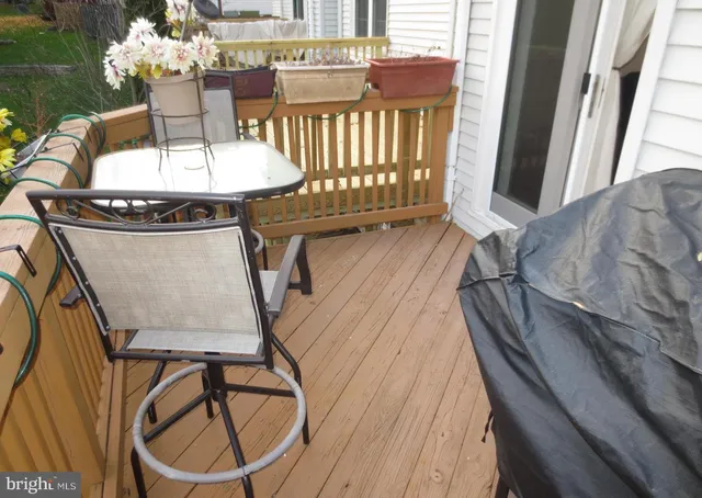 a view of a dining room with furniture and floor to ceiling window