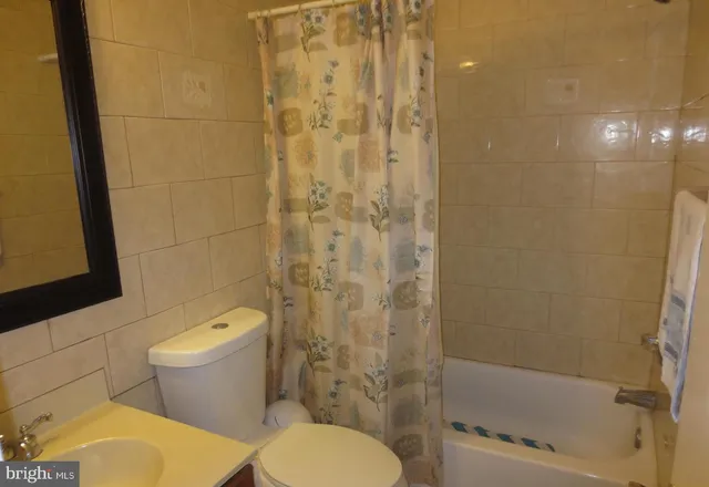 a view of a hallway and wooden floor