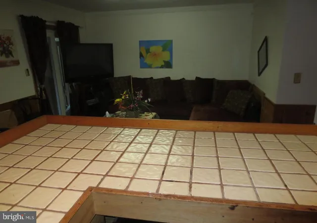 a view of a house with wooden fence