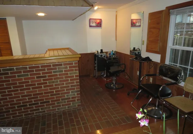 a view of a house with wooden fence