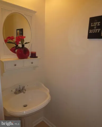 a kitchen with granite countertop a sink stove and microwave