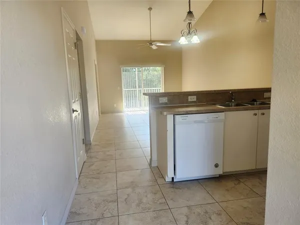 a view of a kitchen with a sink and a stove