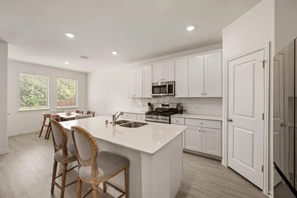a kitchen that has a cabinets counter space and appliances