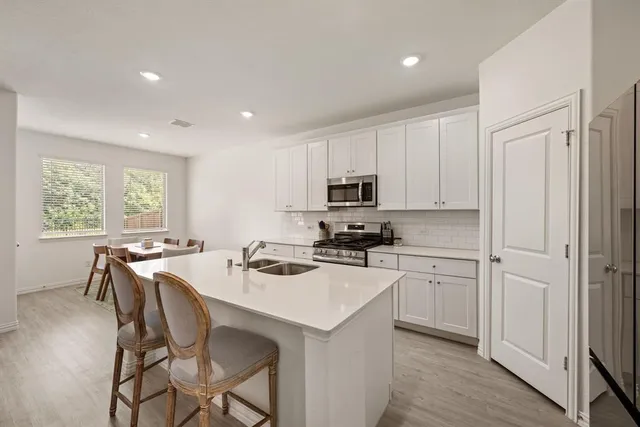 a kitchen that has a cabinets counter space and appliances
