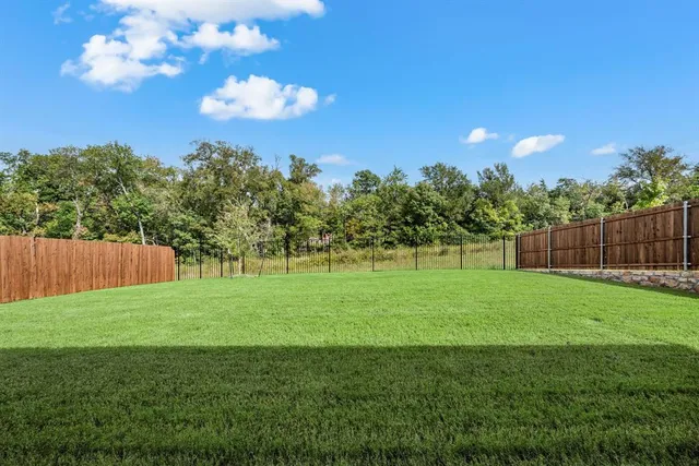 a view of a big yard with an outdoor space and seating