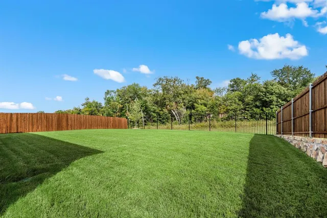 a view of a big yard with a fountain