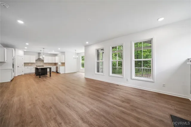 a view of kitchen with furniture and wooden floor