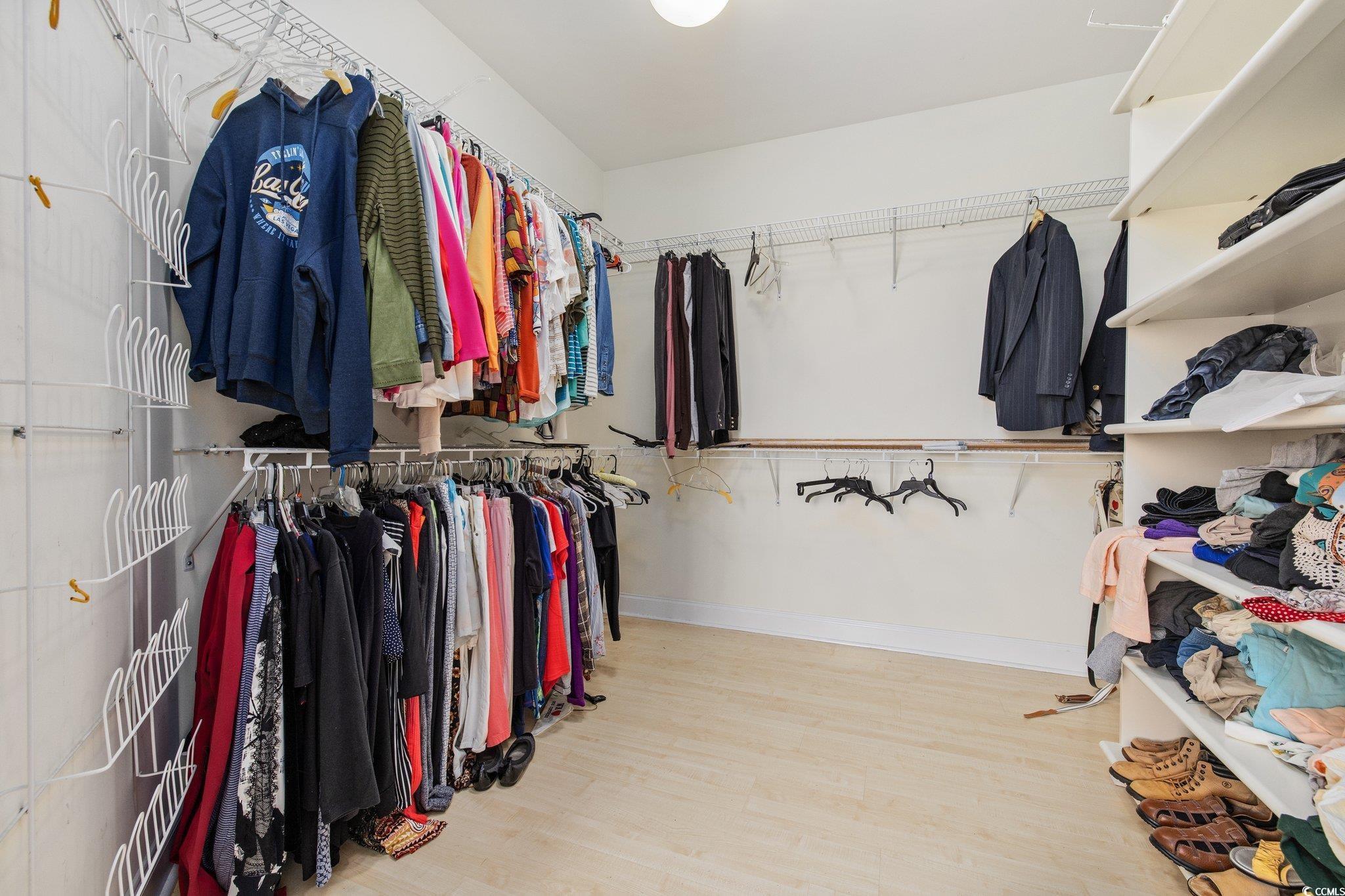 4552 River Road Little River, SC 29566 - Photo 15 of 40 Spacious closet with wood finished floors