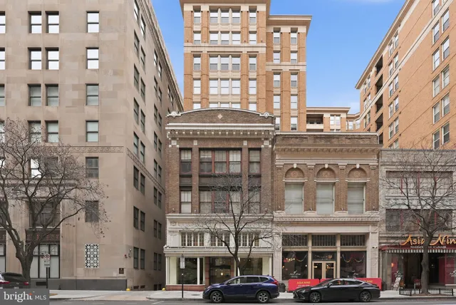 a front view of a building with lot of windows