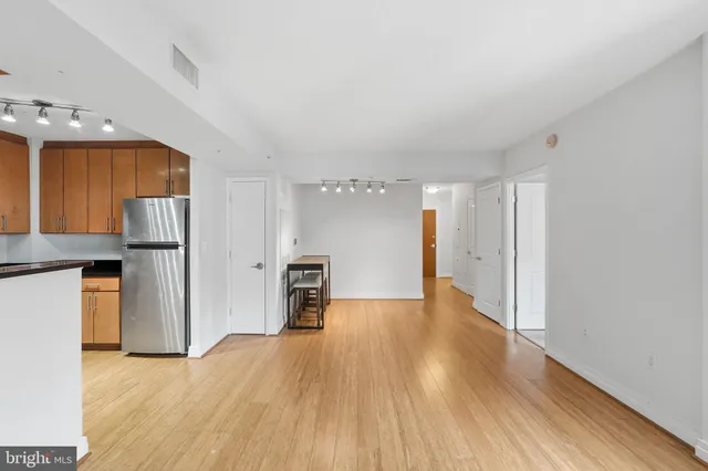 a view of a kitchen with a refrigerator a stove top oven a refrigerator and a dishwasher