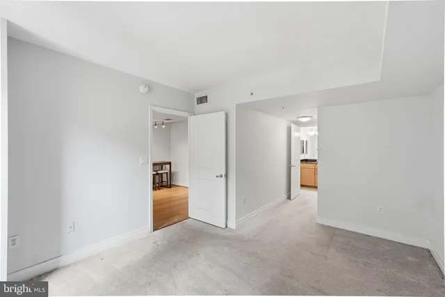 a view of kitchen and refrigerator