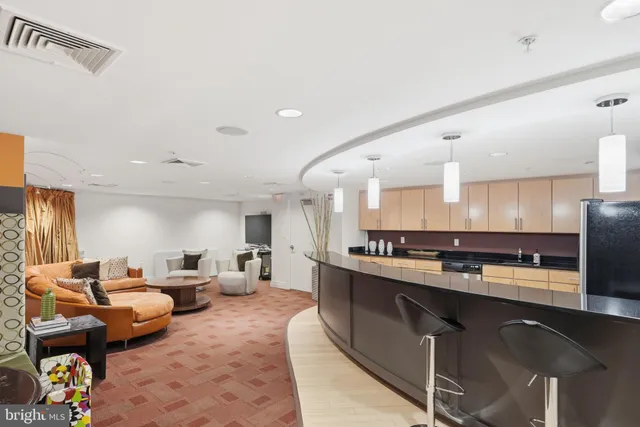 a large kitchen with stainless steel appliances lots of counter space