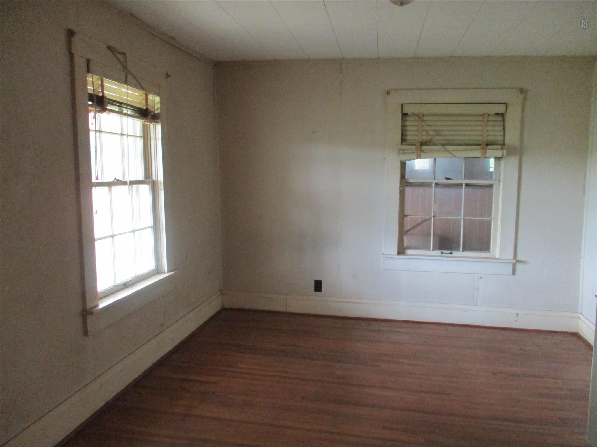 29 Owens Road Five Points, TN 38457 - Photo 17 of 26 an empty room with wooden floor and windows