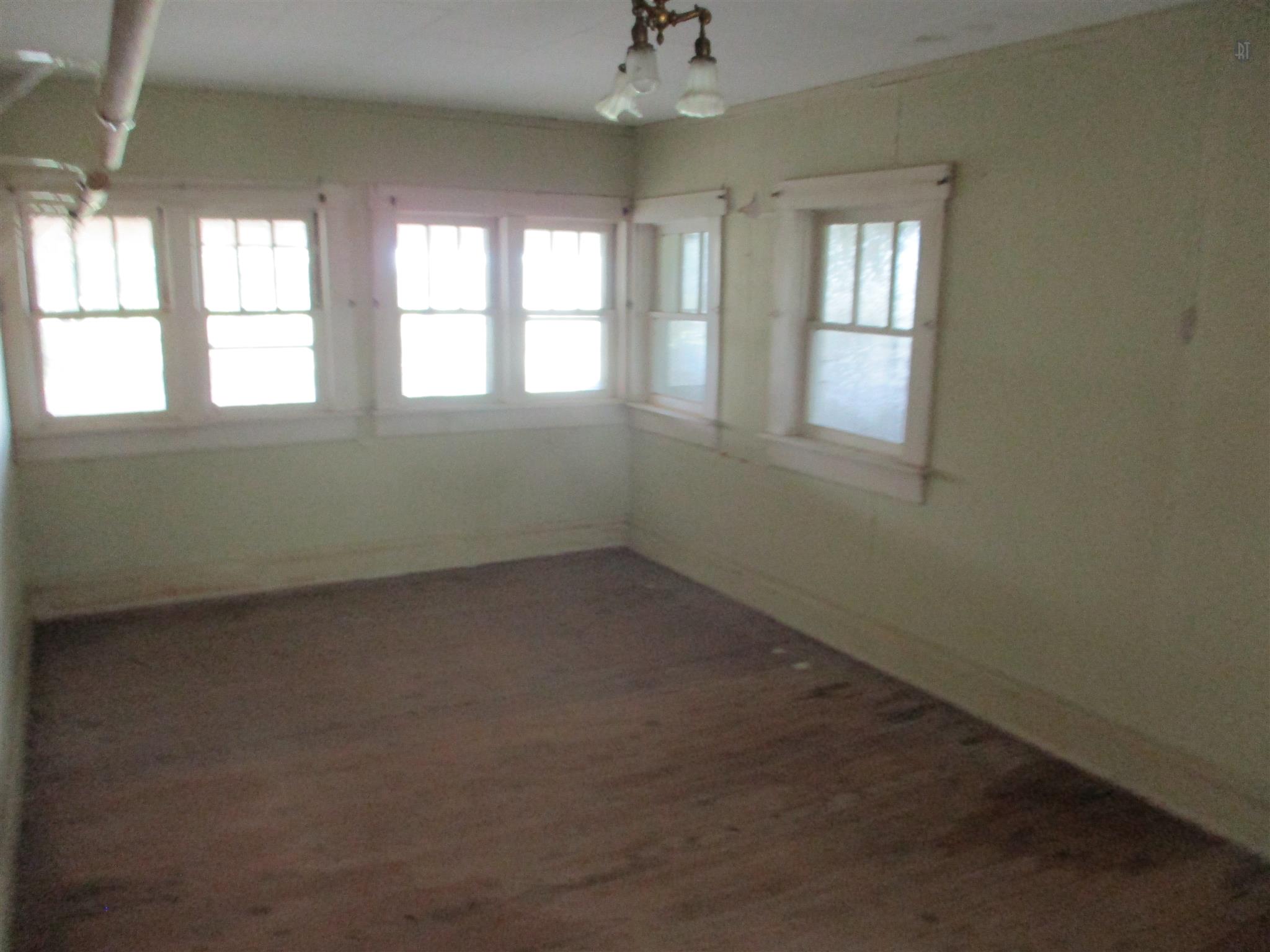 29 Owens Road Five Points, TN 38457 - Photo 18 of 26 an empty room with windows and chandelier