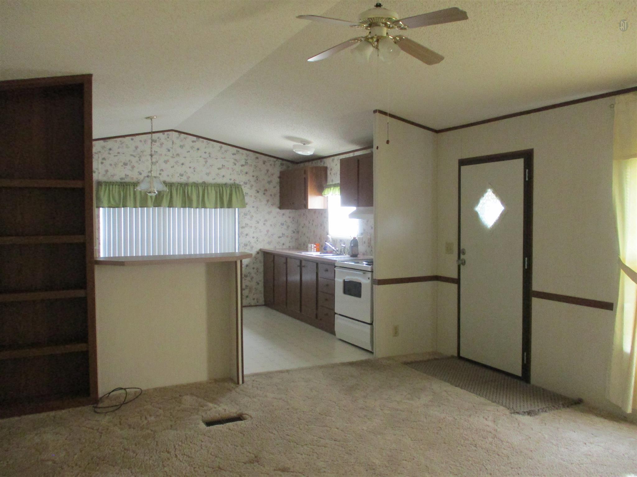 29 Owens Road Five Points, TN 38457 - Photo 23 of 26 a view of a kitchen with a sink and a refrigerator