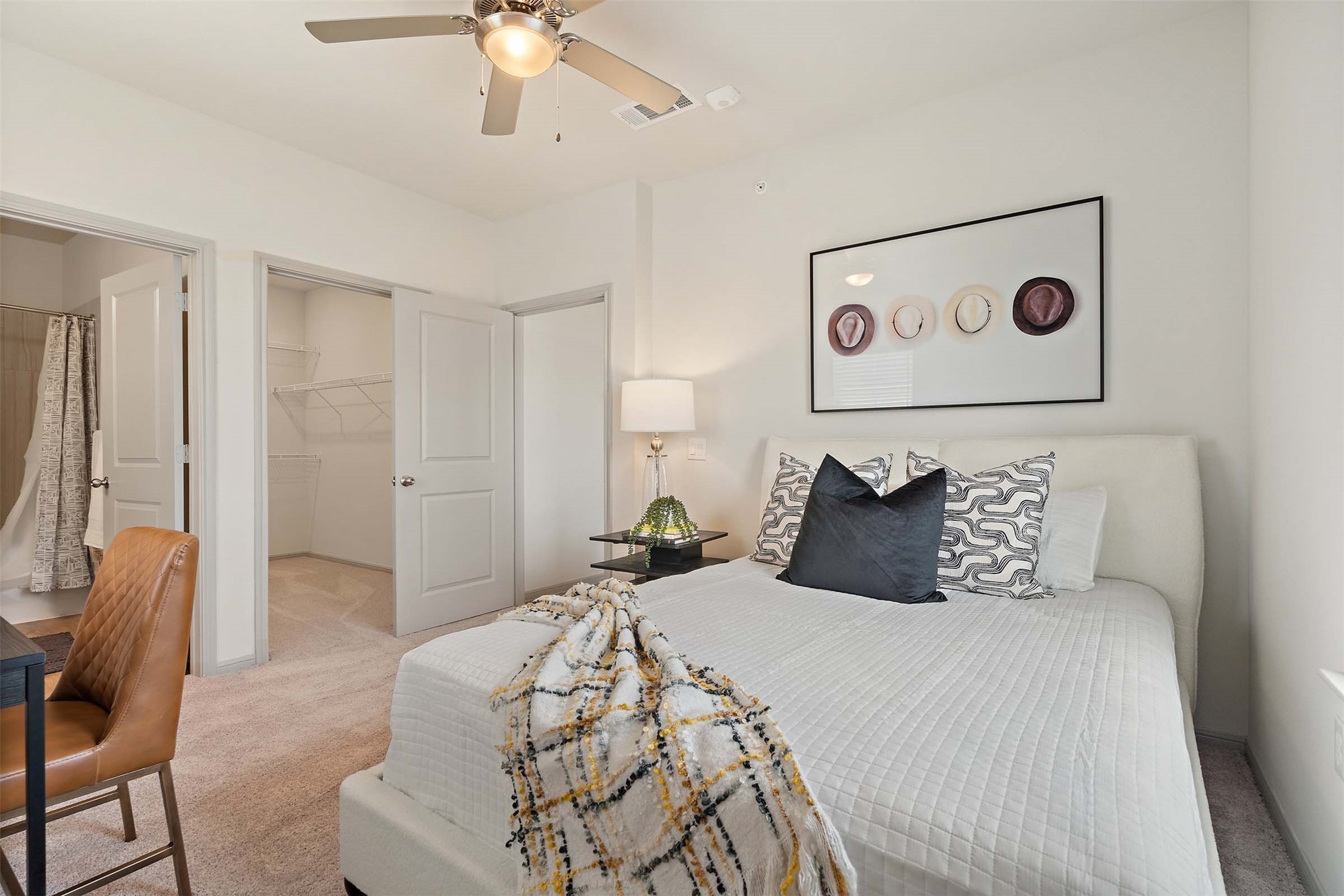 1101 Halsey Drive, Unit 818 Leander, TX 78641 - Photo 40 of 50 a bedroom with a large bed and a chandelier