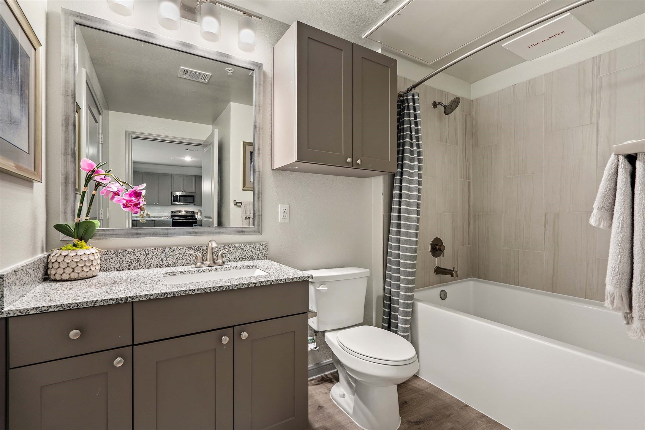 1101 Halsey Drive, Unit 818 Leander, TX 78641 - Photo 44 of 50 a bathroom with a sink a toilet and shower