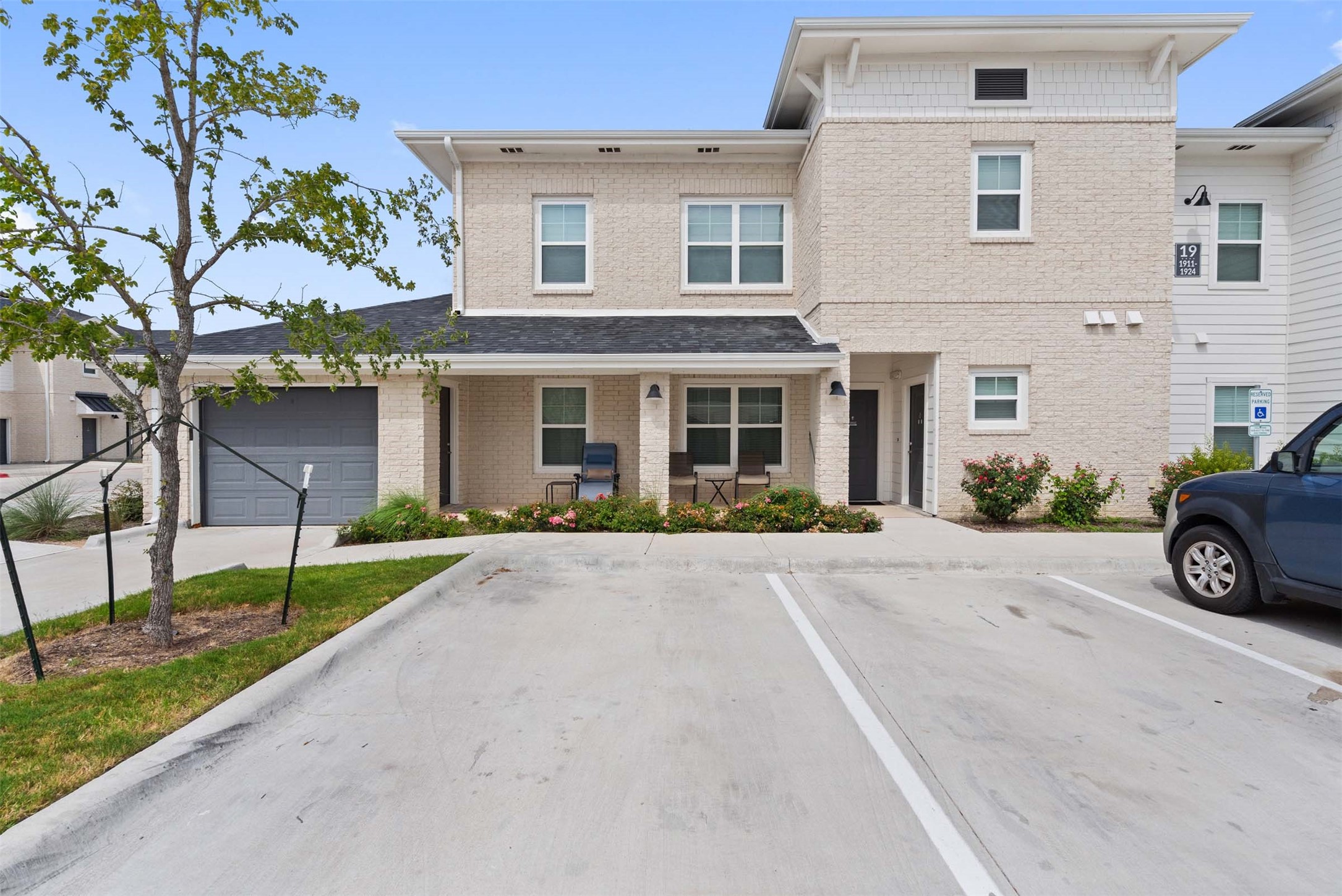 1101 Halsey Drive, Unit 818 Leander, TX 78641 - Photo 10 of 50 a view of a house with a yard and garage