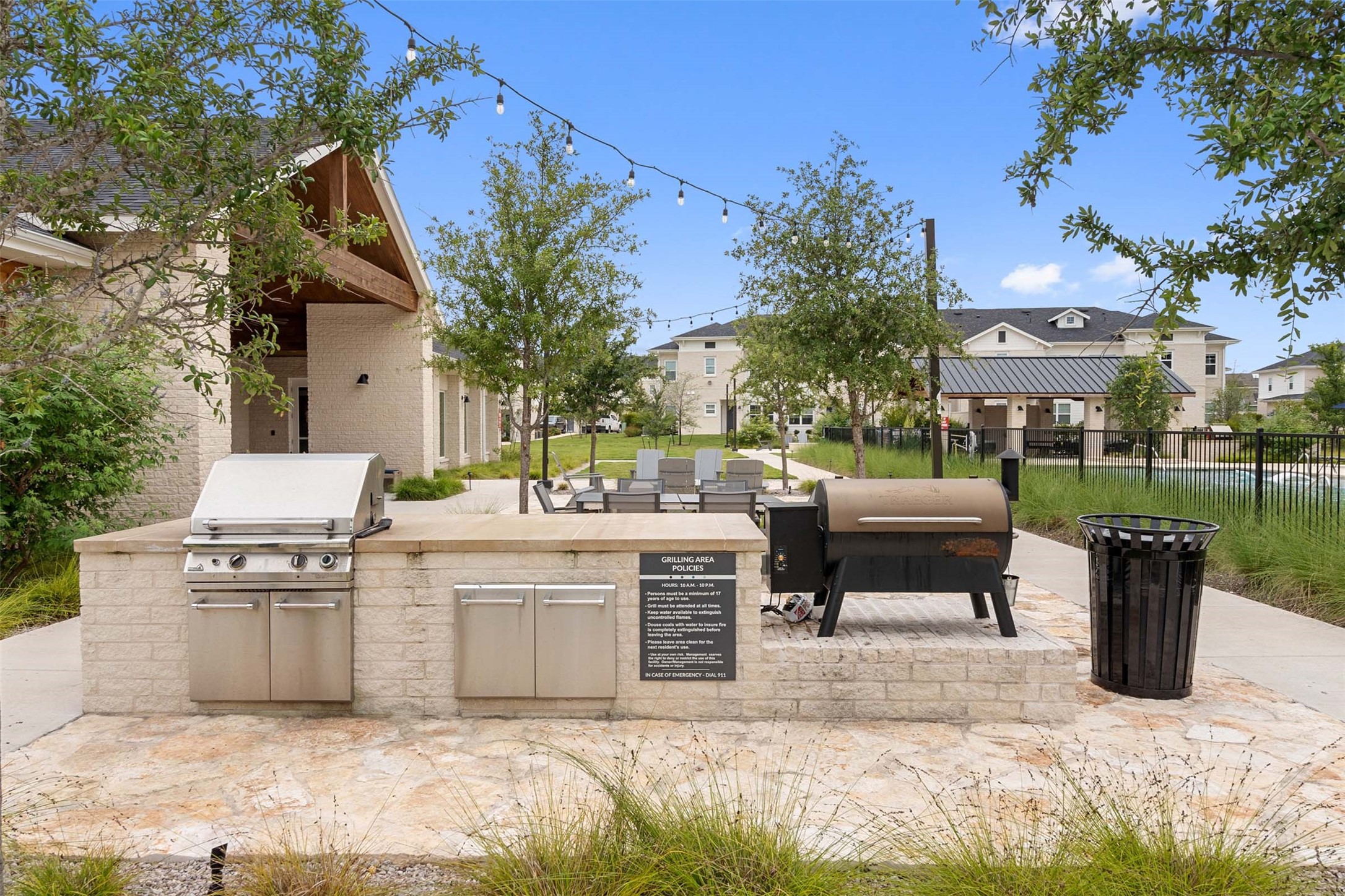 1101 Halsey Drive, Unit 818 Leander, TX 78641 - Photo 11 of 50 a view of a patio with table and chairs potted plants with wooden fence