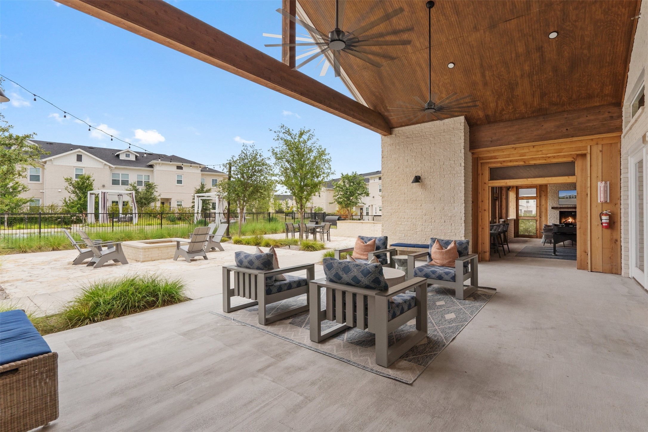 1101 Halsey Drive, Unit 818 Leander, TX 78641 - Photo 14 of 50 a view of a patio with dining table and chairs with a small yard