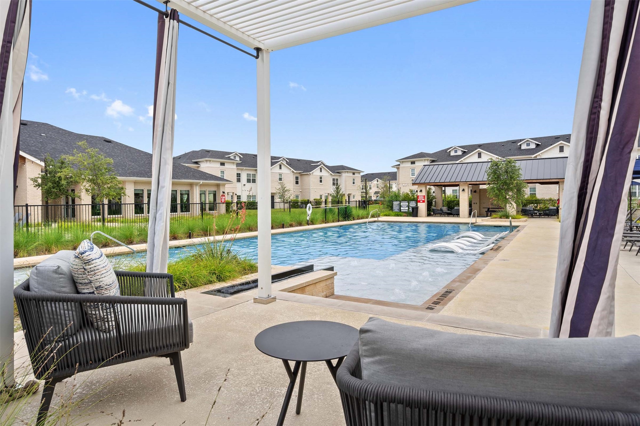 1101 Halsey Drive, Unit 818 Leander, TX 78641 - Photo 18 of 50 a view of an outdoor sitting area with furniture