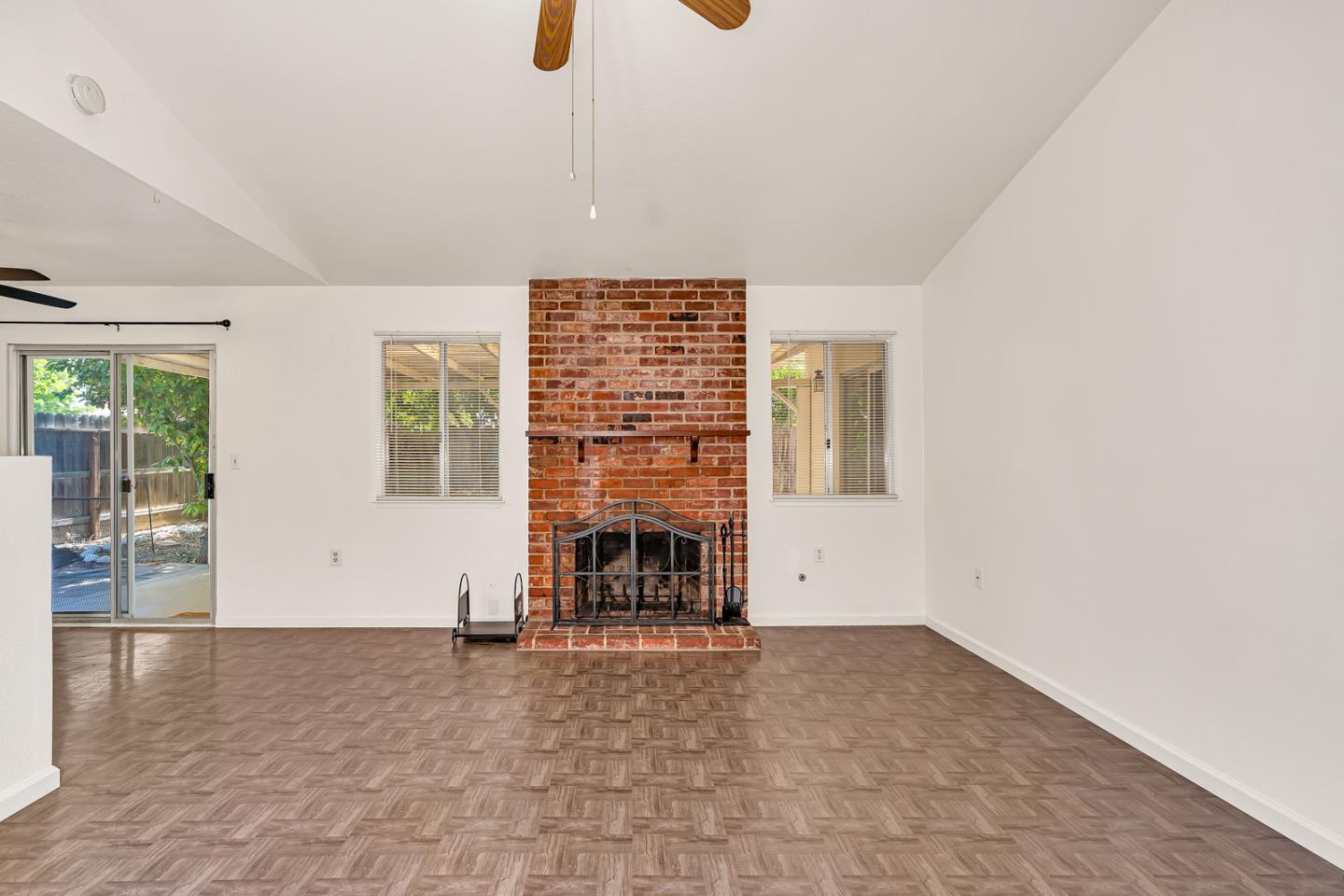 1351 Chukar Street Los Banos, CA 93635 - Photo 11 of 34 an empty room with fireplace and windows