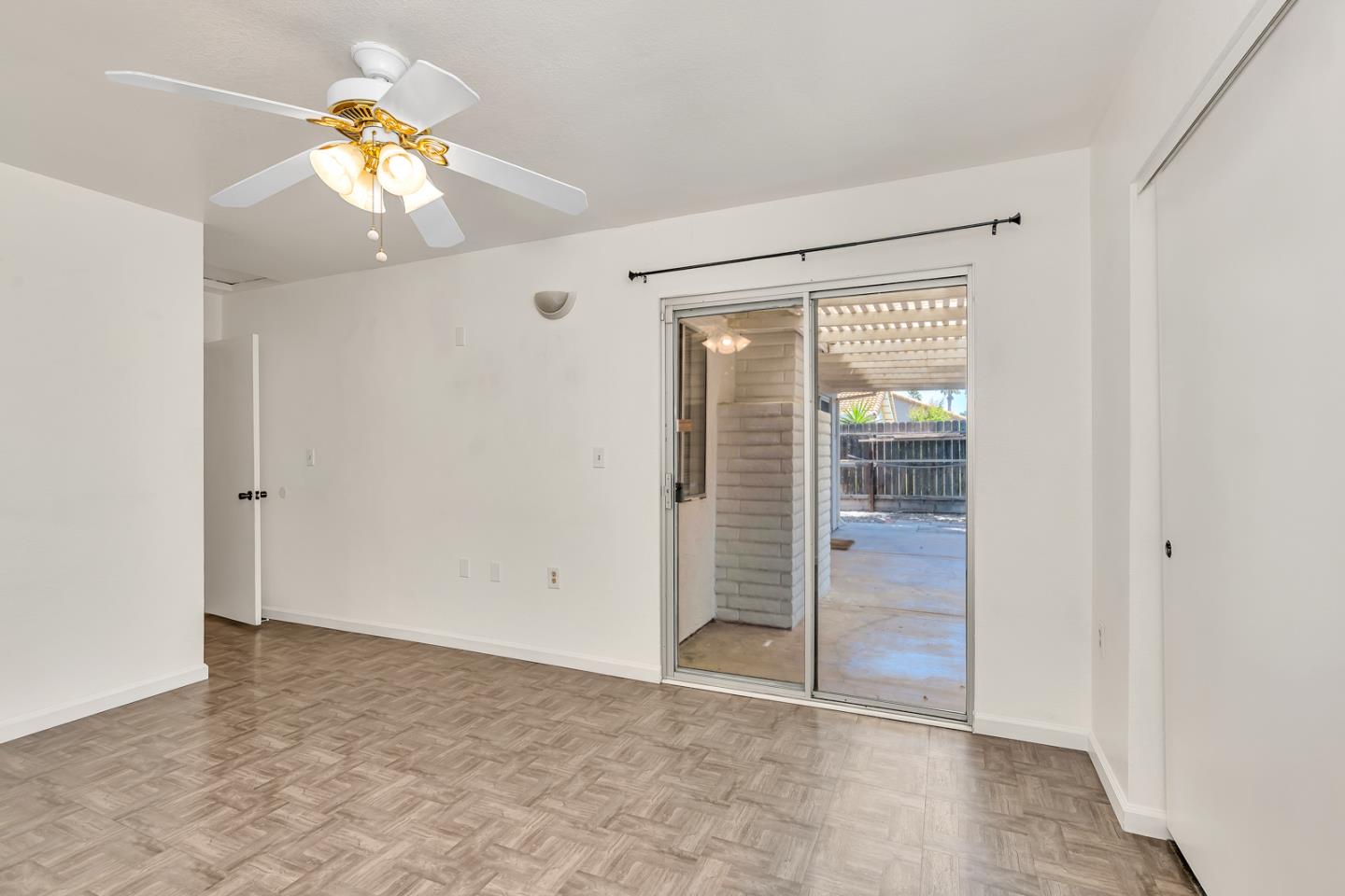 1351 Chukar Street Los Banos, CA 93635 - Photo 21 of 34 an empty room with closet and a chandelier fan