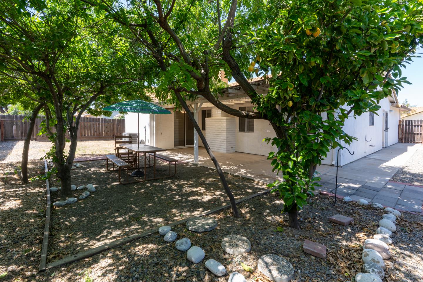 1351 Chukar Street Los Banos, CA 93635 - Photo 26 of 34 a backyard of a house with table and chairs