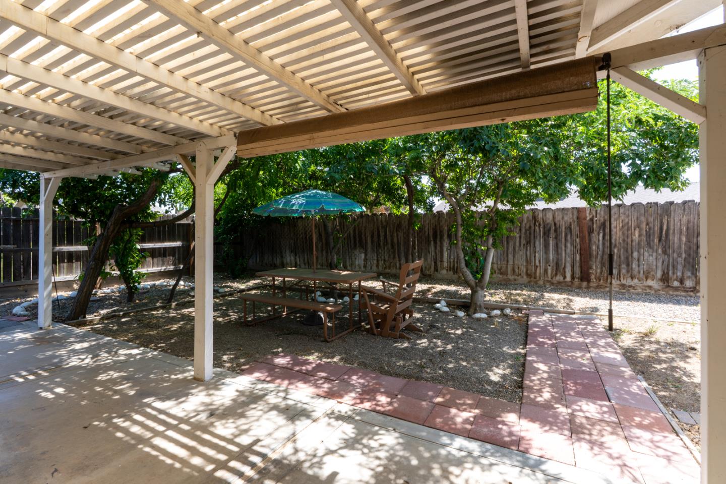 1351 Chukar Street Los Banos, CA 93635 - Photo 30 of 34 a backyard of a house with a tree