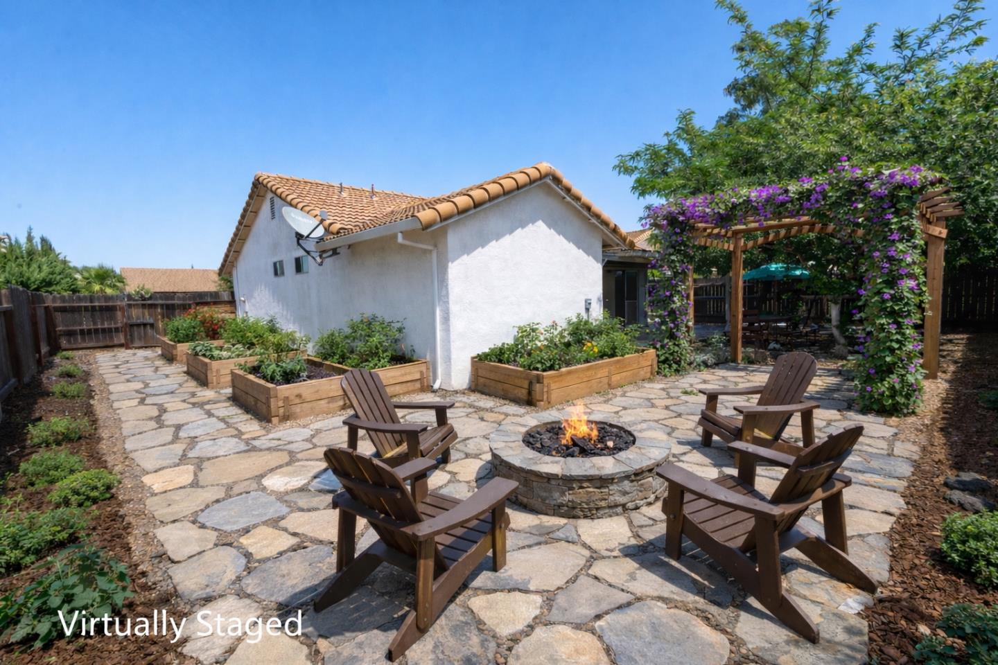 1351 Chukar Street Los Banos, CA 93635 - Photo 31 of 34 a view of a patio with couches table and chairs and potted plants