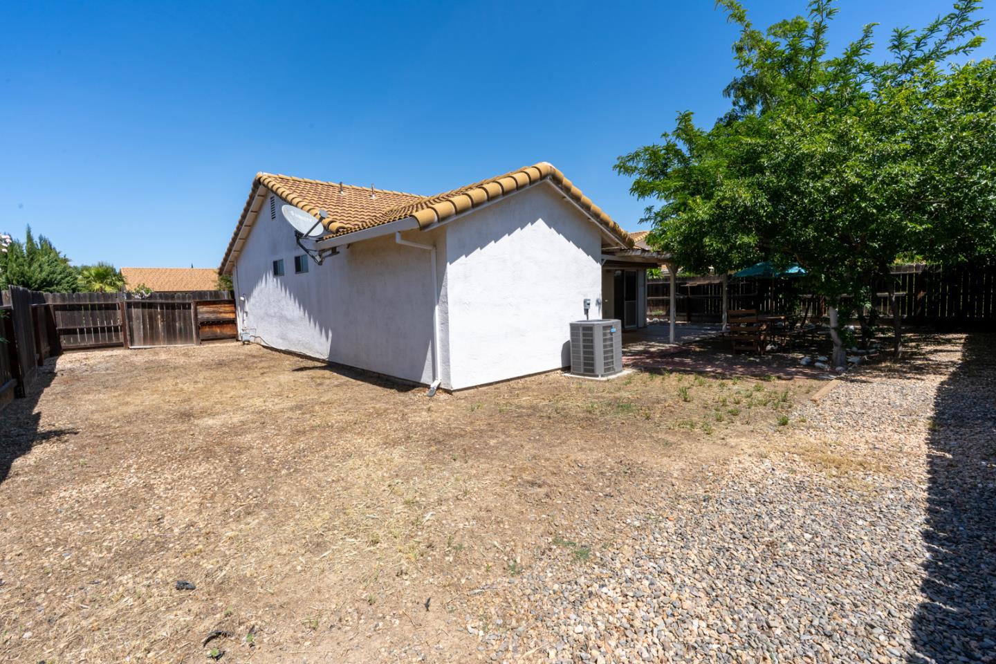 1351 Chukar Street Los Banos, CA 93635 - Photo 32 of 34 a view of a house with a yard and garage