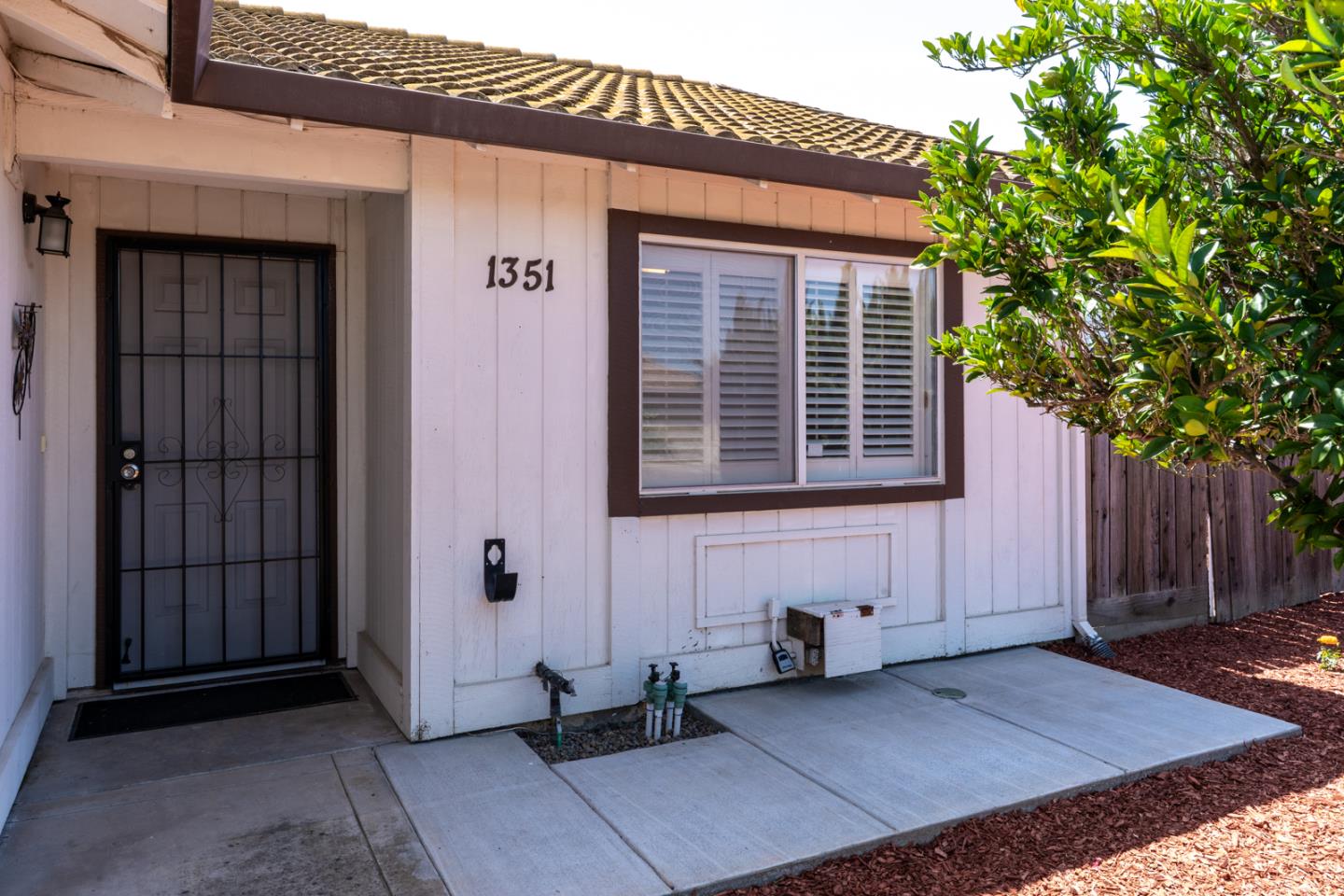 1351 Chukar Street Los Banos, CA 93635 - Photo 4 of 34 a front view of a house with a chair
