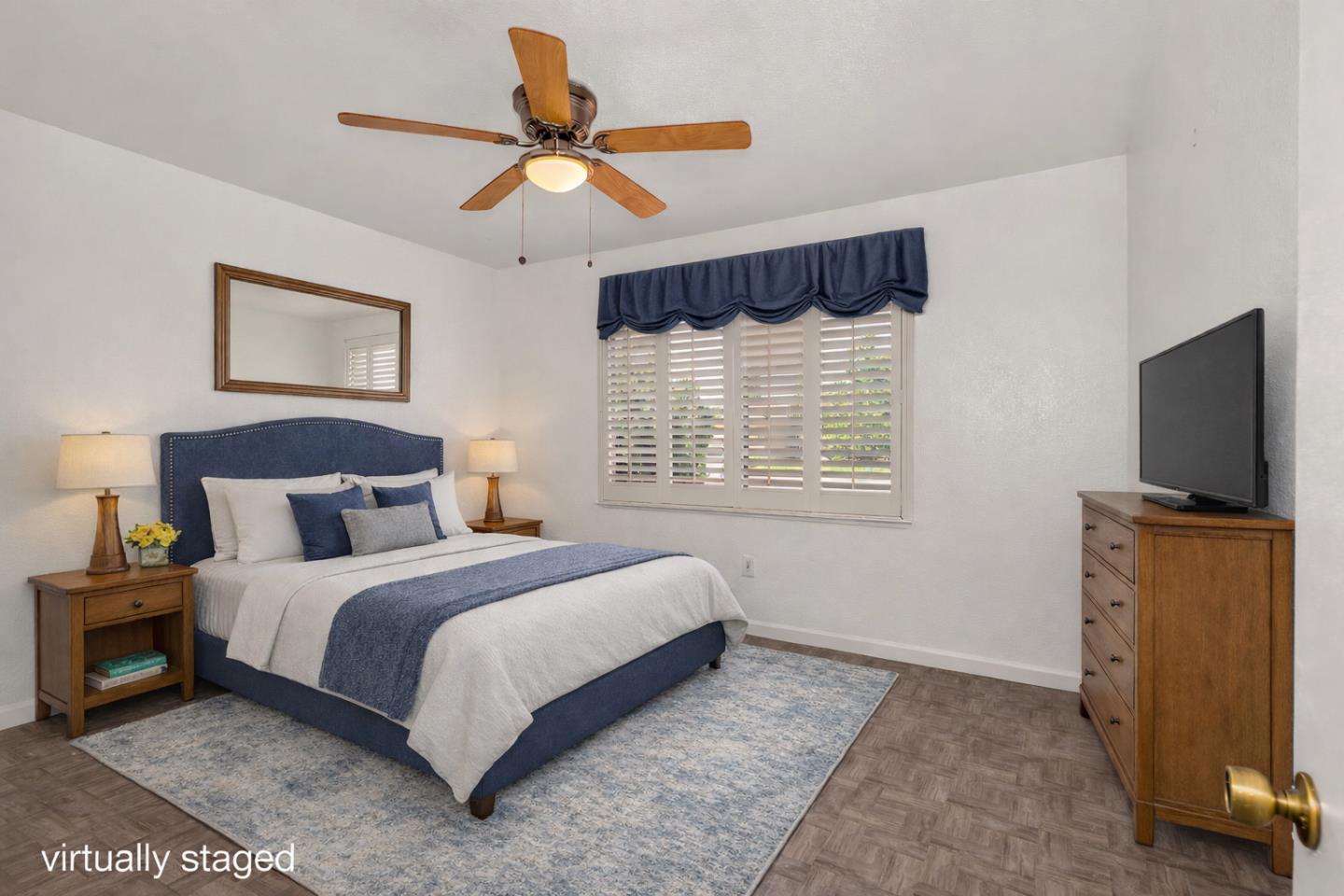 1351 Chukar Street Los Banos, CA 93635 - Photo 8 of 34 a bedroom with a bed and a flat screen tv