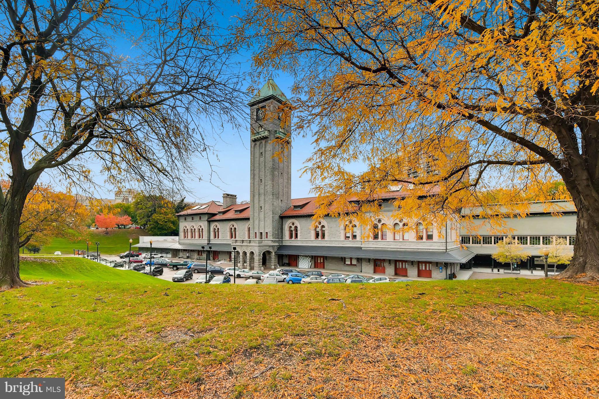 843 North Howard Street, Unit 2 Baltimore, MD 21201 - Photo 11 of 16 a street sign on a building next to a yard