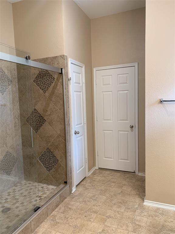 3313 Timber Ridge Trail McKinney, TX 75071 - Photo 11 of 20 Bathroom featuring a shower stall and baseboards