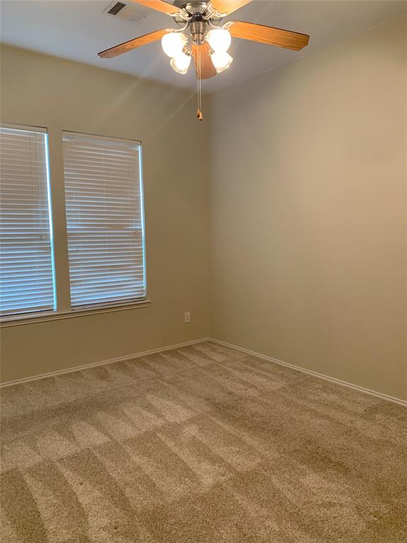 3313 Timber Ridge Trail McKinney, TX 75071 - Photo 12 of 20 Carpeted spare room with ceiling fan, baseboards, and visible vents