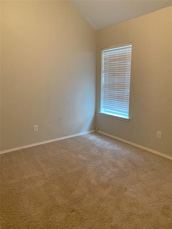 3313 Timber Ridge Trail McKinney, TX 75071 - Photo 14 of 20 Carpeted empty room with lofted ceiling and baseboards