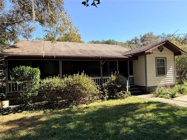 a front view of house with yard and seating area