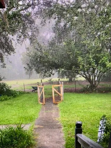 a backyard of a house with lots of green space